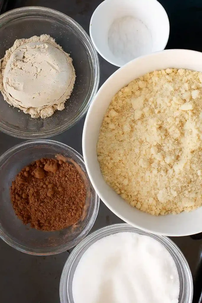 The Ultimate Fudgy Protein Brownies (That Actually Taste Like Dessert) 10 Protein brownie ingredients flat lay