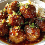 Firecracker Chicken Meatballs served with spicy sweet sauce and fresh green onions